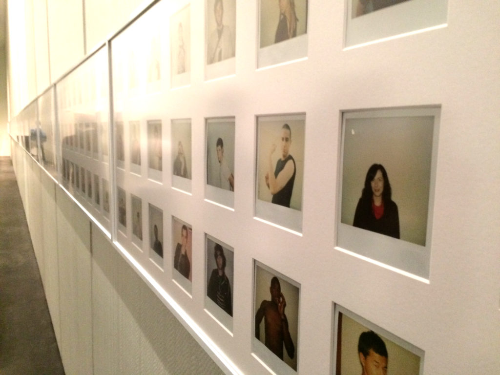 One wall of polaroids featured in Ryan McGinley's The Kids Were Alright.